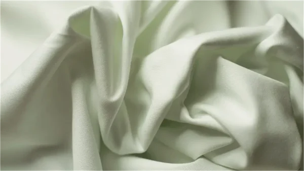 Wrinkled light fabric texture close-up